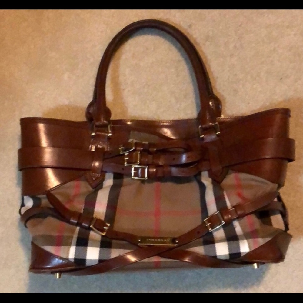 Authentic Burberry saddle bag and wallet.